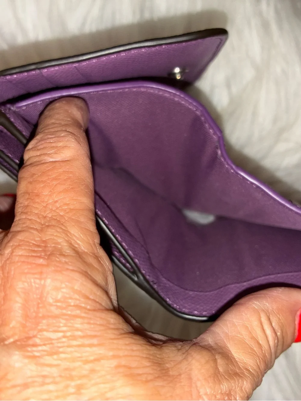 Coach Compact Trifold Pebbled Leather Wallet button closure in Plum/Purple.